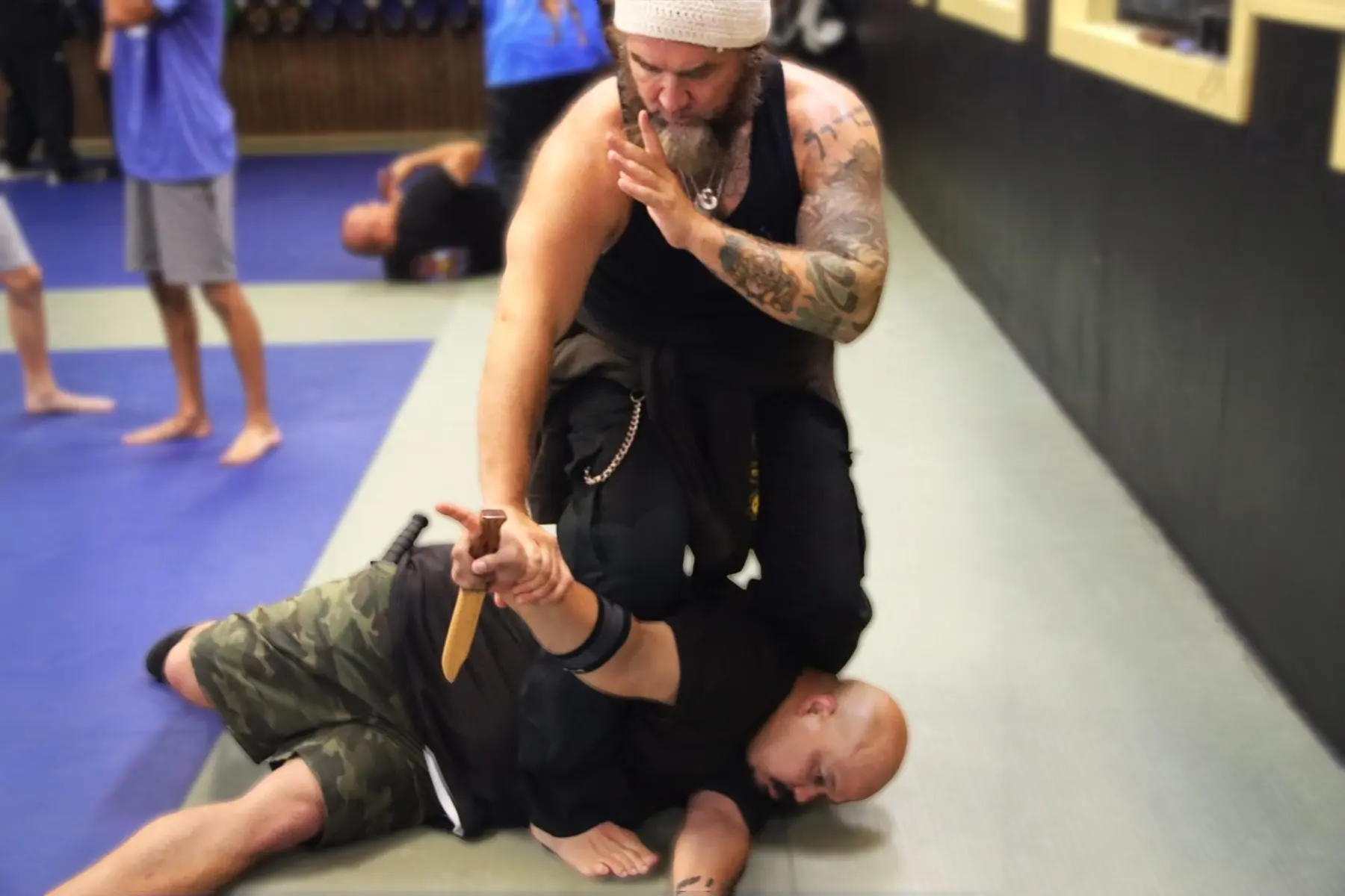 Dr. Micah Naziri controlling a training knife during partner practice