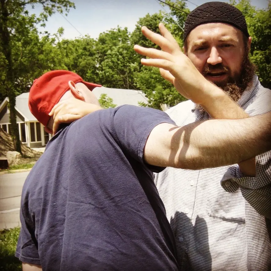 Dr. Micah Naziri demonstrating triangular close-quarters structure with a partner